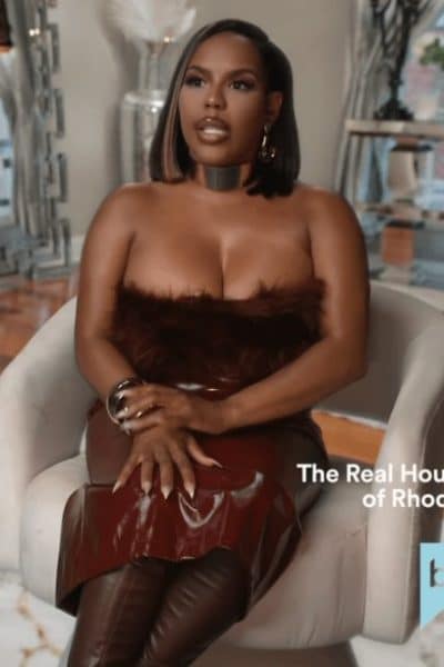 Kelli Ferrell’s Burgundy Strapless Fur Confessional Dress - Product Image